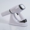 IDEN-X2 handheld dental X-ray unit with charging dock — touchscreen display visible