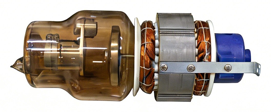 Photograph of an X-ray tube insert: filament and rotating anode disc visible inside the glass envelope, stator windings on the right