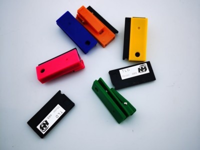 Thermoluminescent dosimeter badges in several colours